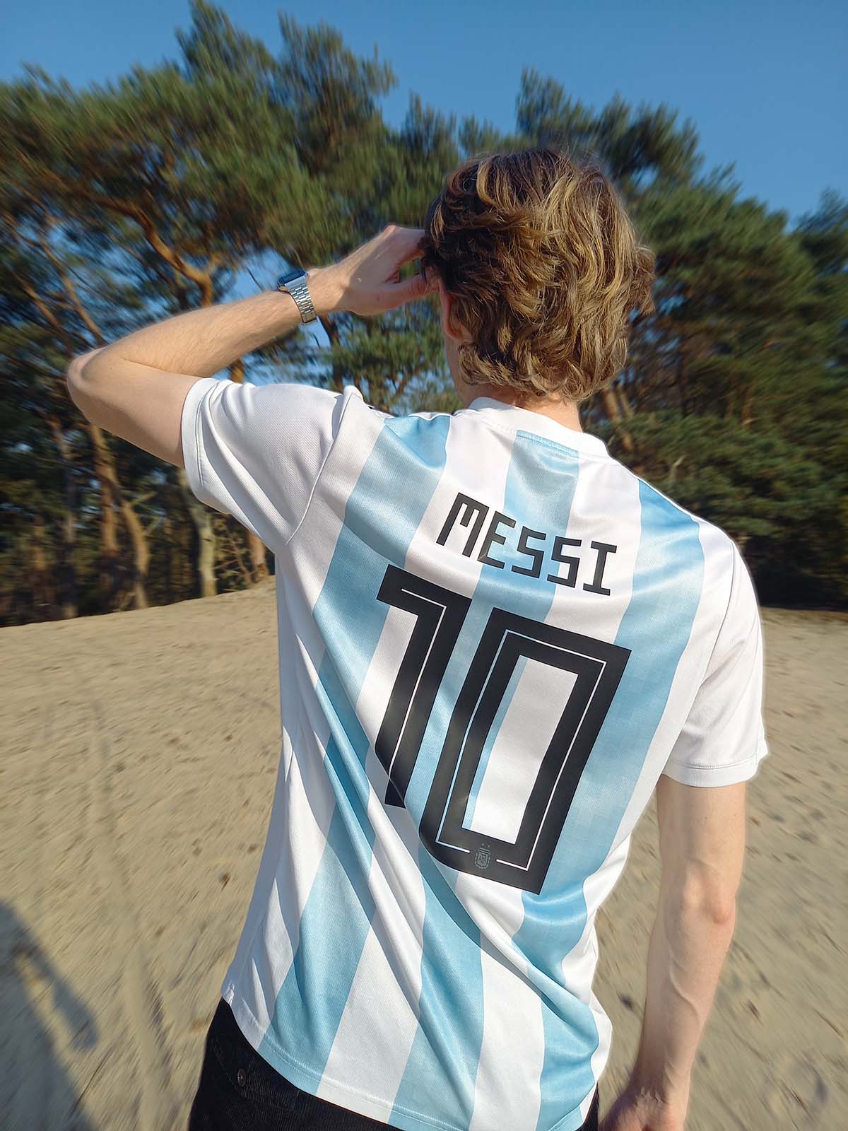 Messi Argentina football shirt in the sand